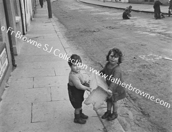 STREET SCENE CHILDREN AT PLAY